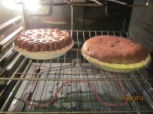 Both pies baking in the oven. Wow. Look how high they rose!