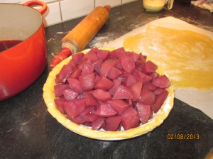Wine soaked cut-up pears in the pastry shell