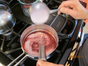Whisking the strawberry gelatin into the sugar and cornstarch mixture
