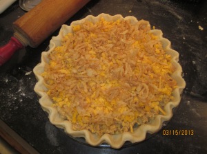 Filling ingredients in the pie shell- Ready for the oven